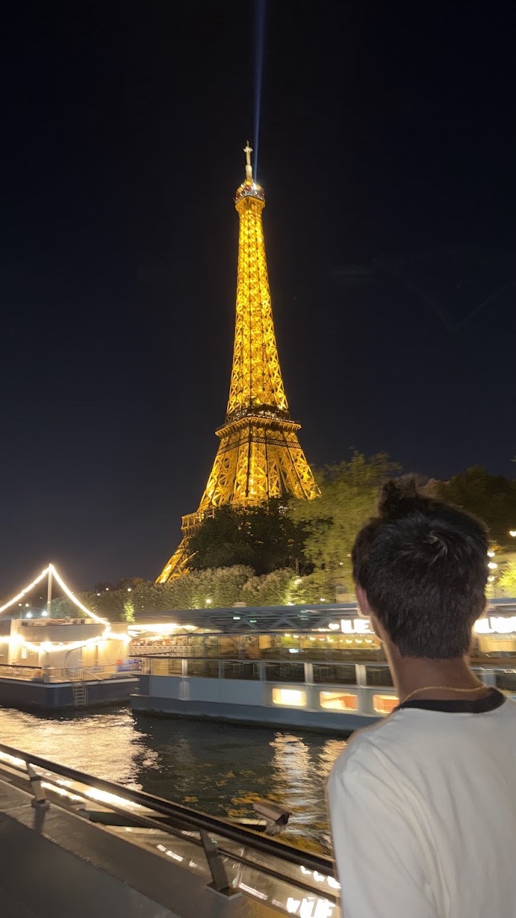 Eiffel Tower at night from a Seine boat
